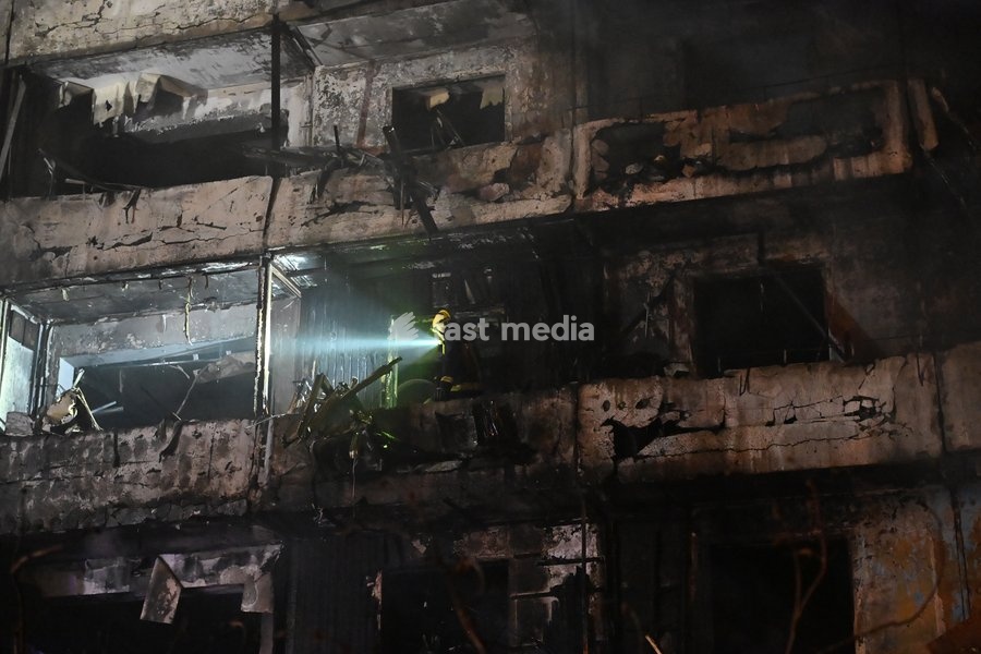 A rescuer works at the site of a Russian missile strike on a nine-story residential building in Kyiv’s Desnianskyi district, Ukraine, on October 14, 2026. Russia launched a massive ballistic missile attack on the capital. Three women were killed and 19 people were injured in the Desnianskyi…