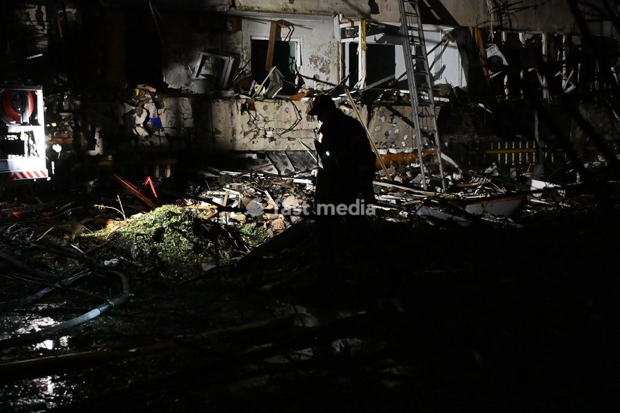 A rescuer works at the site of a Russian missile strike on a nine-story residential building in Kyiv’s Desnianskyi district, Ukraine, on October 14, 2026. Russia launched a massive ballistic missile attack on the capital. Three women were killed and 19 people were injured in the Desnianskyi…