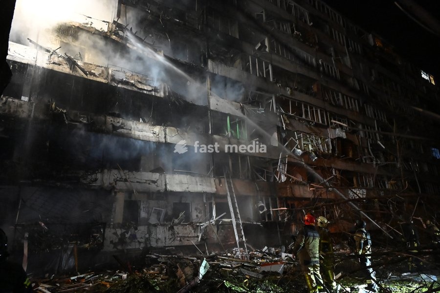 Rescuers extinguish a fire that broke out following a Russian missile strike on a nine-story residential building in Kyiv’s Desnianskyi district, Ukraine, on October 14, 2026. Russia launched a massive ballistic missile attack on the capital. Three women were killed and 19 people were injured in…