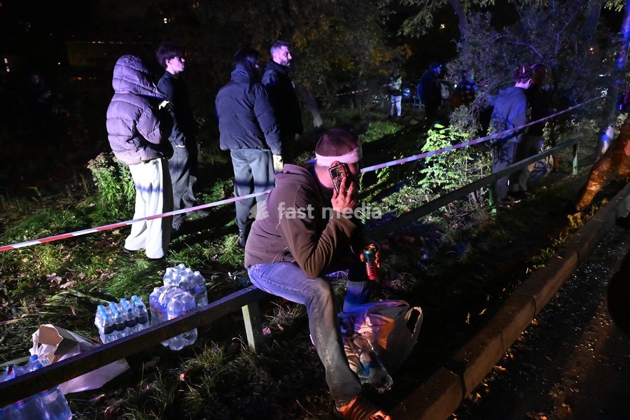 A man injured in a Russian missile strike on a nine-story residential building talks on the phone in Kyiv’s Desnianskyi district, Ukraine, on October 14, 2026. Russia launched a massive ballistic missile attack on the capital. Three women were killed and 19 people were injured in the Desnianskyi…