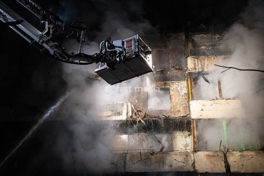 A rescuer on an aerial platform extinguishes a fire that broke out following a Russian missile strike on a nine-story residential building in Kyiv’s Desnianskyi district, Ukraine, on October 14, 2026. Russia launched a massive ballistic missile attack on the capital. Three women were killed and 19…