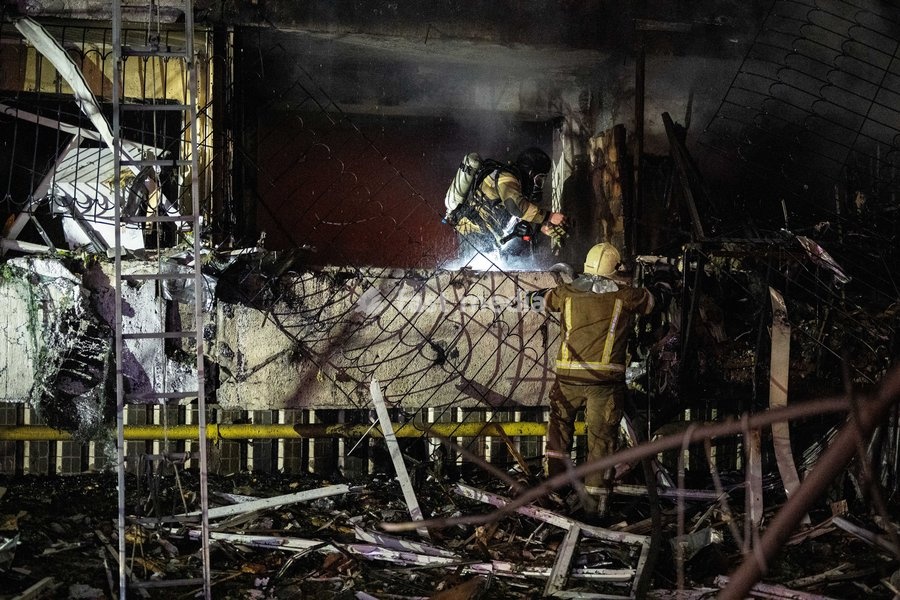 Rescuers work at the scene of a Russian missile strike on a nine-story residential building in Kyiv’s Desnianskyi district, Ukraine, on October 14, 2026. Russia launched a massive ballistic missile attack on the capital. Three women were killed and 19 people were injured in the Desnianskyi…