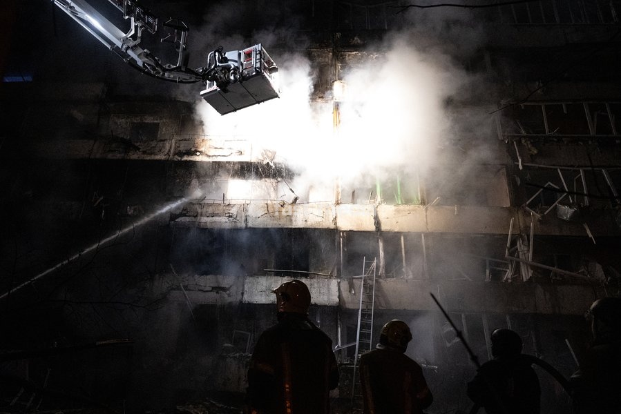 Rescuers work during efforts to eliminate the aftermath of a Russian missile strike on a nine-story residential building in Kyiv’s Desnianskyi district, Ukraine, on October 14, 2026. Russia launched a massive ballistic missile attack on the capital. Three women were killed and 19 people were…