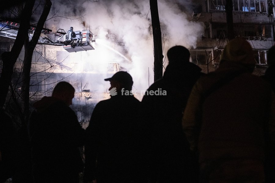 A rescuer on an aerial platform extinguishes a fire that broke out following a Russian missile strike on a nine-story residential building in Kyiv’s Desnianskyi district, Ukraine, on October 14, 2026. Russia launched a massive ballistic missile attack on the capital. Three women were killed and 19…