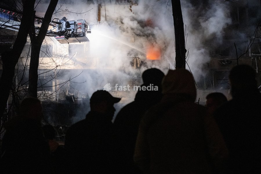 A rescuer on an aerial platform extinguishes a fire that broke out following a Russian missile strike on a nine-story residential building in Kyiv’s Desnianskyi district, Ukraine, on October 14, 2026. Russia launched a massive ballistic missile attack on the capital. Three women were killed and 19…