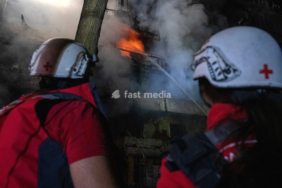 A fire that broke out following a Russian missile strike on a nine-story residential building is seen in Kyiv’s Desnianskyi district, Ukraine, on October 14, 2026. Russia launched a massive ballistic missile attack on the capital. Three women were killed and 19 people were injured in the…