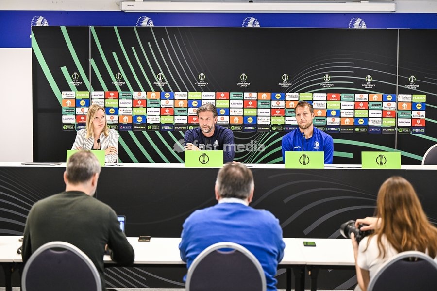 Gent's communications manager Tahnee Leece; Gent's head coach Rik De Mil and Gent's goalkeeper Davy Roef pictured during a press conference of Belgian soccer team KAA Gent, Wednesday 14 October 2026 in Gent. The team is preparing for the opening match of the UEFA Conference League league phase…