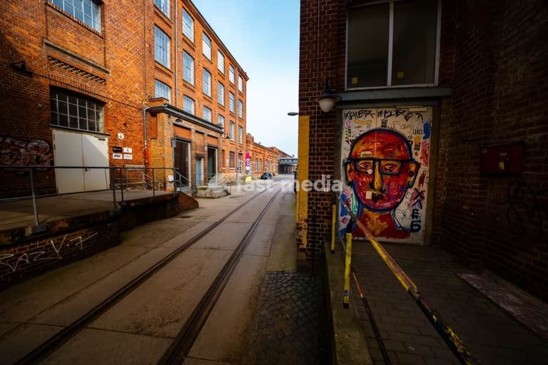 Leipzig Baumwollspinnerei industrial courtyard with rails and graffiti, artist studios in Plagwitz Germany