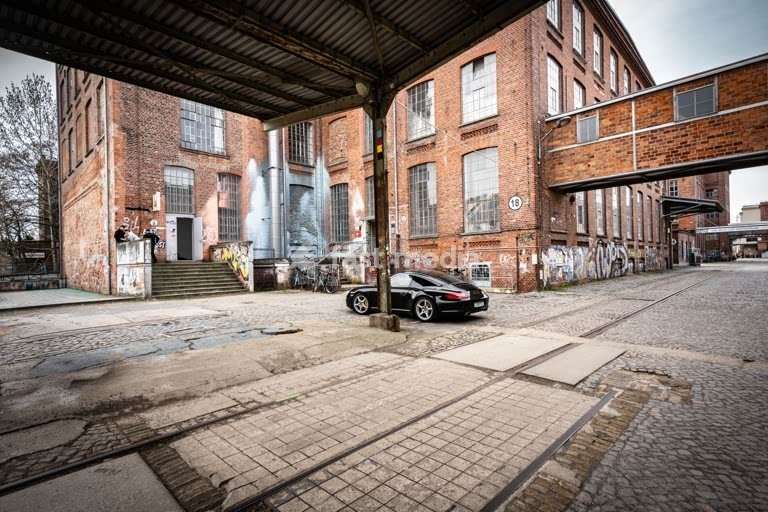 Leipzig Baumwollspinnerei industrial courtyard with rails and graffiti, artist studios in Plagwitz Germany