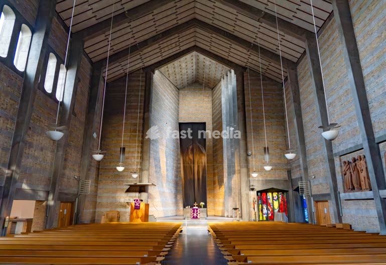 St. Johannis Würzburg church has been destroyed in WWII bombing and has been rebuilt with twin spires and a modern interior, Würzburg Bavaria Germany