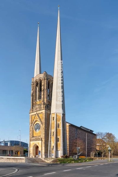 St. Johannis Würzburg church has been destroyed in WWII bombing and has been rebuilt with twin spires and a modern interior, Würzburg Bavaria Germany