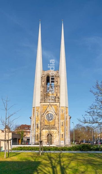 St. Johannis Würzburg church has been destroyed in WWII bombing and has been rebuilt with twin spires and a modern interior, Würzburg Bavaria Germany