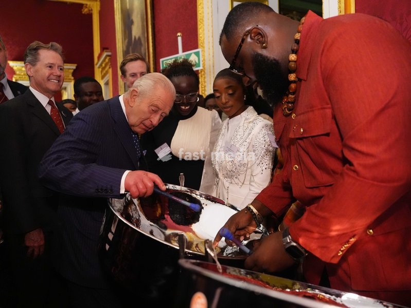 King Charles III tries his hand at playing a steelpan drum with Khan Cordice during a reception at St. James's Palace in London, to celebrate the Commonwealth Diaspora, ahead of the Commonwealth Heads of Government Meeting in Antigua and Barbuda. Picture date: Wednesday October 14, 2026