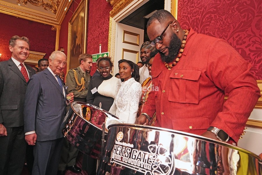 King Charles III watching Khan Cordice play the steel drums during a reception at St. James's Palace in London, to celebrate the Commonwealth Diaspora, ahead of the Commonwealth Heads of Government Meeting in Antigua and Barbuda. Picture date: Wednesday October 14, 2026