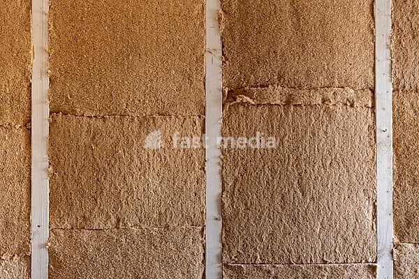 Close-up of rough brown wooden fiber insulation panels between light wooden strips, old building renovation, Stuttgart, Baden-Württemberg, Germany