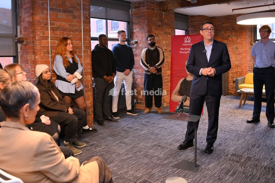 Britain's Prime Minister Andy Burnham speaks to employees during his visit of the King's Trust charity in Manchester, England, Thursday, Oct. 15, 2026