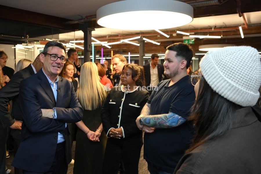 Britain's Prime Minister Andy Burnham speaks to employees during his visit of the King's Trust charity in Manchester, England, Thursday, Oct. 15, 2026