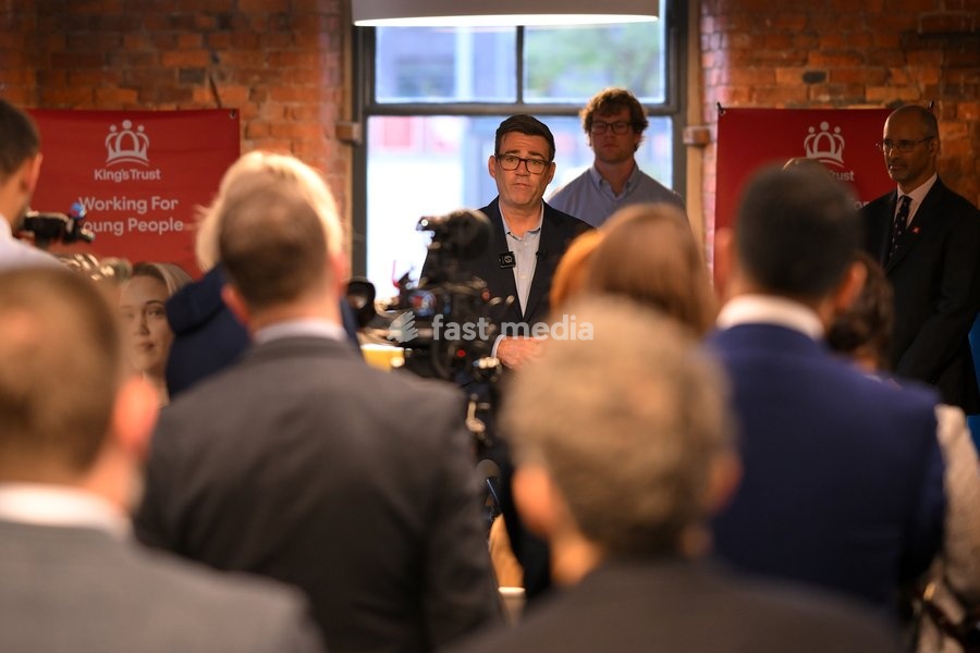 Britain's Prime Minister Andy Burnham speaks to employees during his visit of the King's Trust charity in Manchester, England, Thursday, Oct. 15, 2026