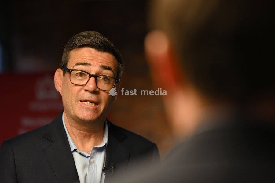 Britain's Prime Minister Andy Burnham speaks to employees during his visit of the King's Trust charity in Manchester, England, Thursday, Oct. 15, 2026