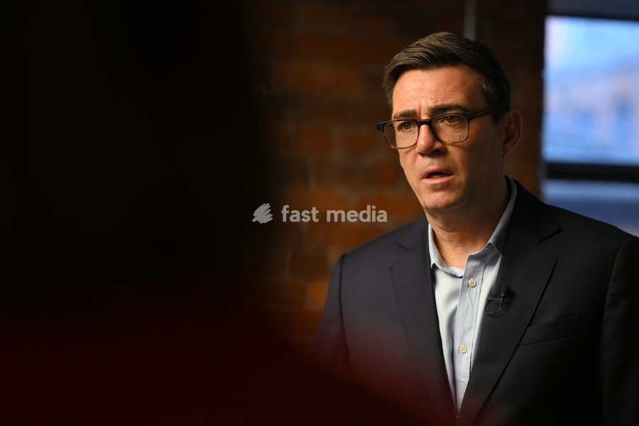 Britain's Prime Minister Andy Burnham lspeaks to employees during his visit of the King's Trust charity in Manchester, England, Thursday, Oct. 15, 2026