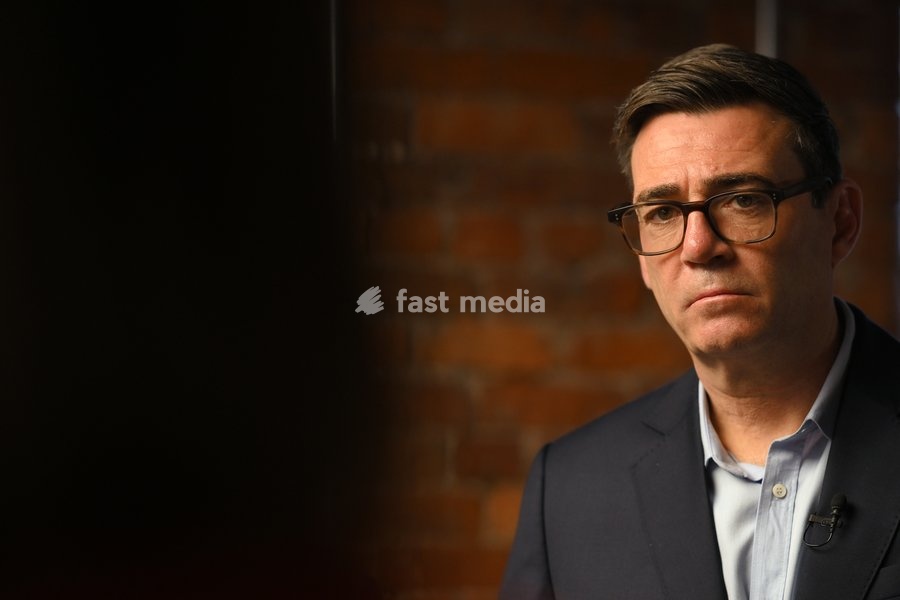 Britain's Prime Minister Andy Burnham listens to employees during his visit of the King's Trust charity in Manchester, England, Thursday, Oct. 15, 2026