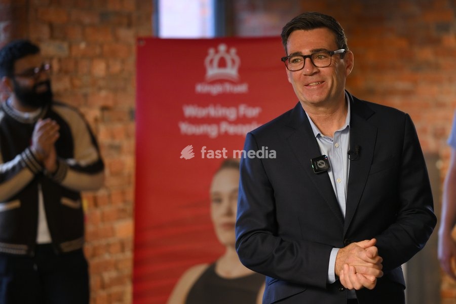 Britain's Prime Minister Andy Burnham speaks to employees during his visit of the King's Trust charity in Manchester, England, Thursday, Oct. 15, 2026