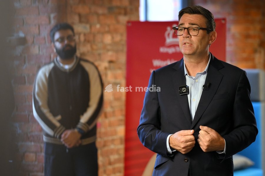Britain's Prime Minister Andy Burnham speaks to employees during his visit of the King's Trust charity in Manchester, England, Thursday, Oct. 15, 2026