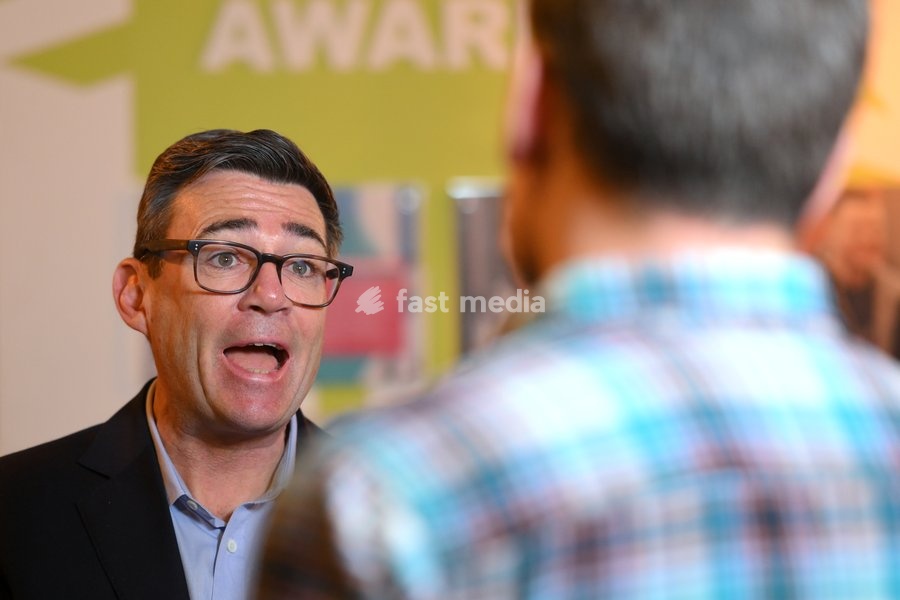 Britain's Prime Minister Andy Burnham speaks to employees during his visit of the King's Trust charity in Manchester, England, Thursday, Oct. 15, 2026