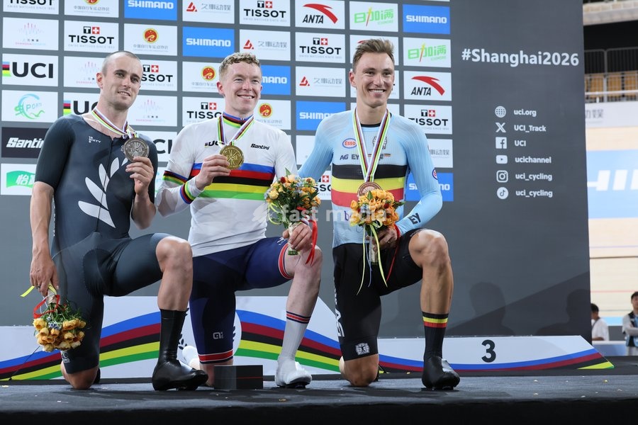 New Zealand's Tom Sexton; Britain's Matthew Bostock and Belgian Lindsay De Vylder celebrate on the podium after the Men's Scratch event at the UCI Track Cycling World Championships in Shanghai, China on Thursday 15 October 2026. The worlds are taking place from 14 to 18 October 2026