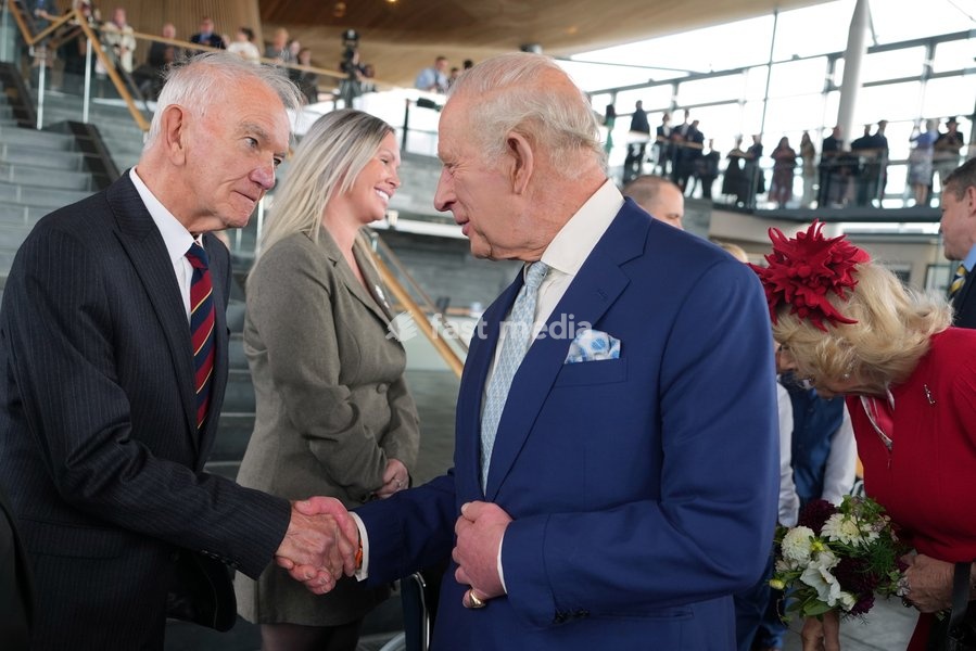 Britain's King Charles III shakes hands with Len Moss after attending the Ceremonial Opening of the Seventh Senedd in Cardiff, Wales, Thursday, Oct. 15, 2026