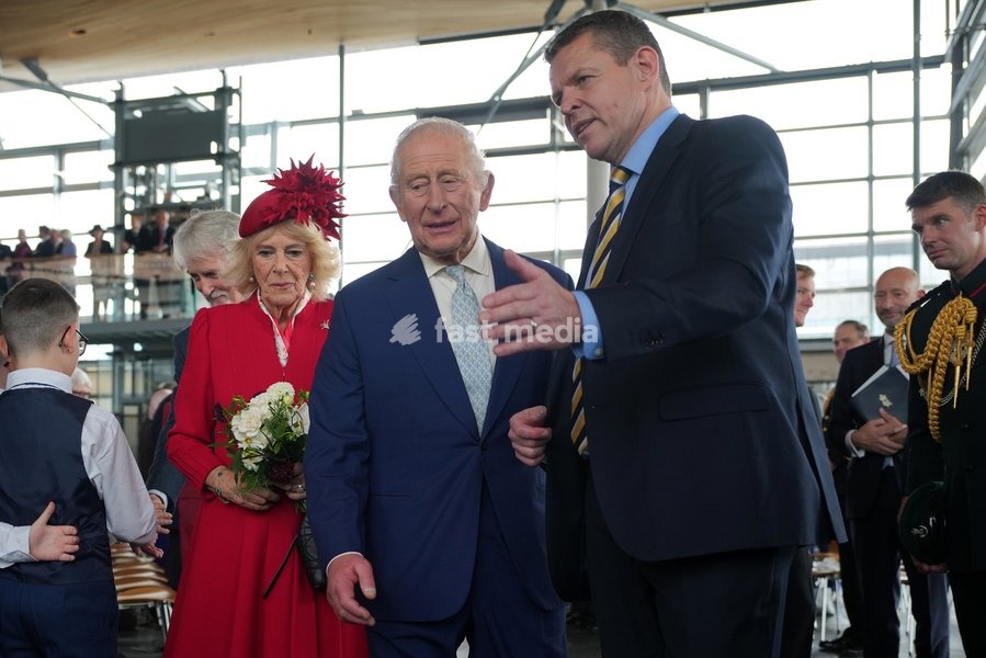 Britain's King Charles III and Queen Camilla are directed by First Minister of Wales, Rhun ap Iorwerth as they attend the Ceremonial Opening of the Seventh Senedd in Cardiff, Wales, Thursday, Oct. 15, 2026