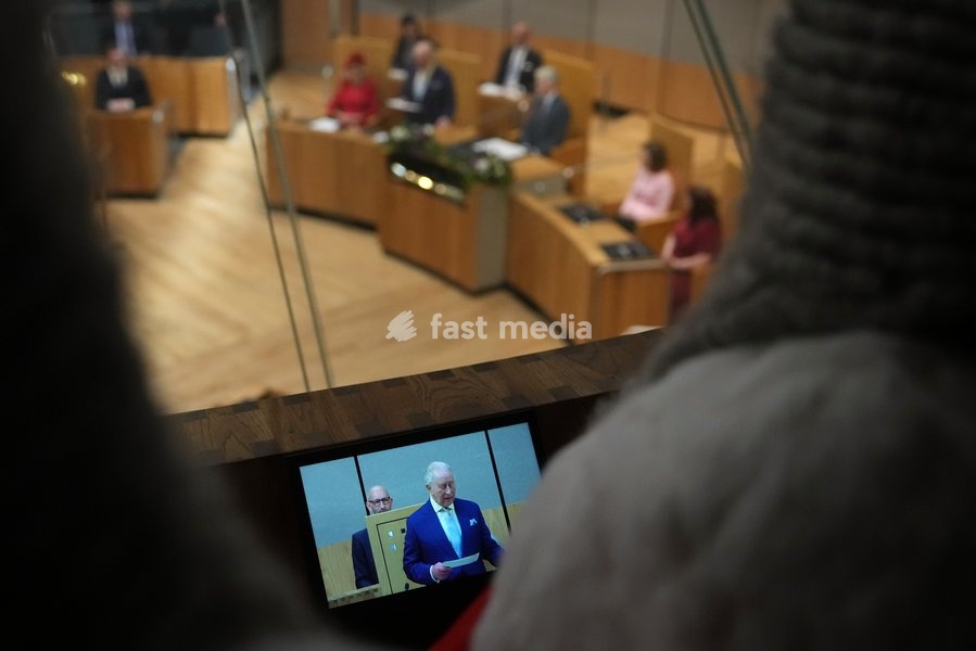Britain's King Charles III is seen on a small screen as he speaks during the Ceremonial Opening of the Seventh Senedd in Cardiff, Wales, Thursday, Oct. 15, 2026