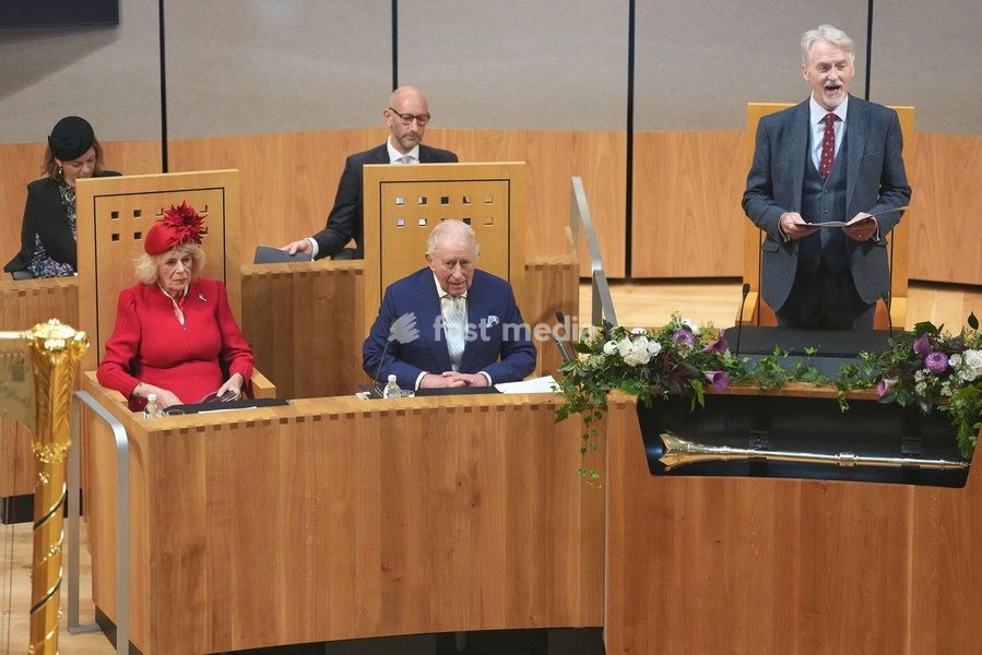 Britain's King Charles III and Queen Camilla listen to Presiding Officer Huw Irranca Davies during the Ceremonial Opening of the Seventh Senedd in Cardiff, Wales, Thursday, Oct. 15, 2026