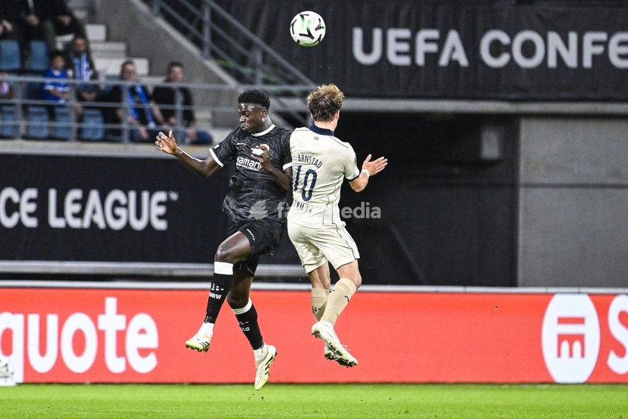 Gent's Ibrahima Cisse and Aarhus' Kristian Arnstad pictured in action during a soccer game between Belgian KAA Gent and Danish Aarhus GF, Thursday 15 October 2026 in Gent, the opening match of the UEFA Conference League league phase