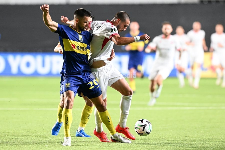 STVV's Visar Musliu; Iberia's Amiran Dzagania and STVV's Shogo Taniguchi pictured in action during a soccer game between Belgian Sint-Truidense VV and Georgian FC Iberia 1999 Tbilisi, Thursday 15 October 2026 in Sint-Truiden, the opening match of the UEFA Conference League league phase