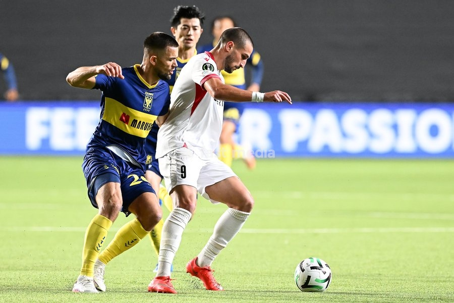 STVV's Visar Musliu; Iberia's Amiran Dzagania and STVV's Shogo Taniguchi pictured in action during a soccer game between Belgian Sint-Truidense VV and Georgian FC Iberia 1999 Tbilisi, Thursday 15 October 2026 in Sint-Truiden, the opening match of the UEFA Conference League league phase