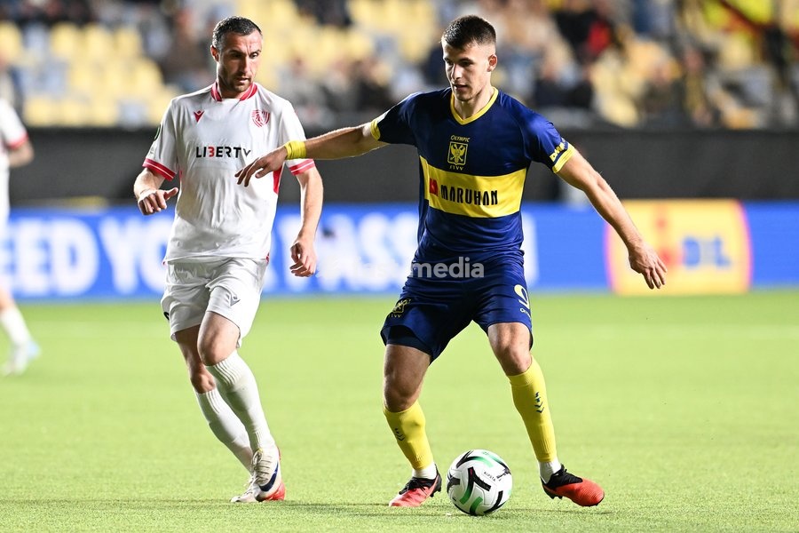 Iberia's Bakar Kardava and STVV's Samed Bazdar pictured in action during a soccer game between Belgian Sint-Truidense VV and Georgian FC Iberia 1999 Tbilisi, Thursday 15 October 2026 in Sint-Truiden, the opening match of the UEFA Conference League league phase