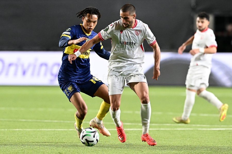 STVV's Nelson Ishiwatari and Iberia's Amiran Dzagania pictured in action during a soccer game between Belgian Sint-Truidense VV and Georgian FC Iberia 1999 Tbilisi, Thursday 15 October 2026 in Sint-Truiden, the opening match of the UEFA Conference League league phase