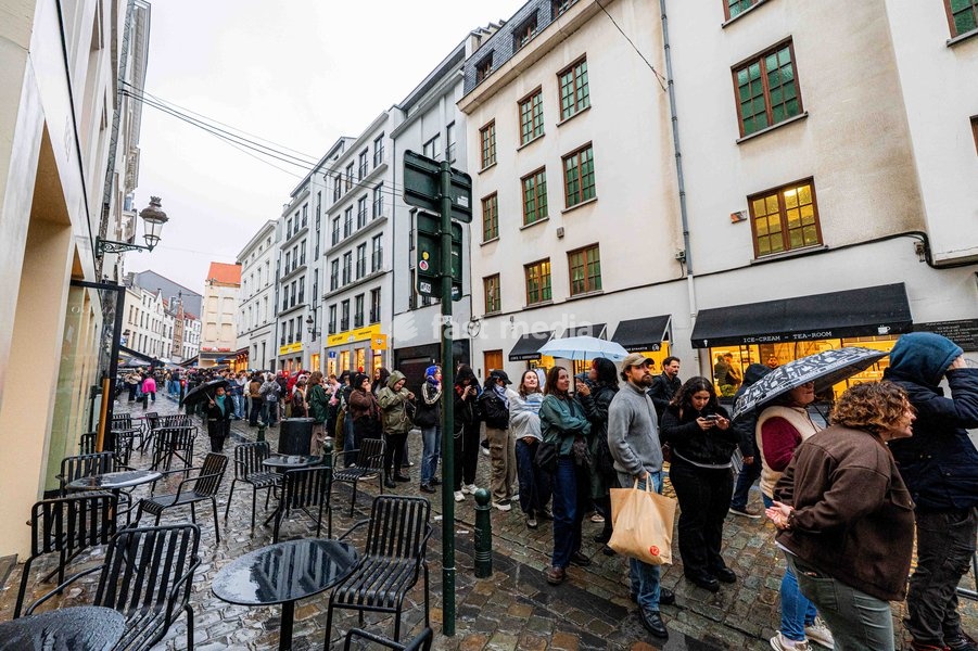 People pictured in the queue ahead of the "Angele Instinct Release Party", a surprise party organized by the Brussels singer to celebrate the release of her album "Instinct" at the Grote Markt/ Grand Place, in Brussels, Friday 16 October 2026