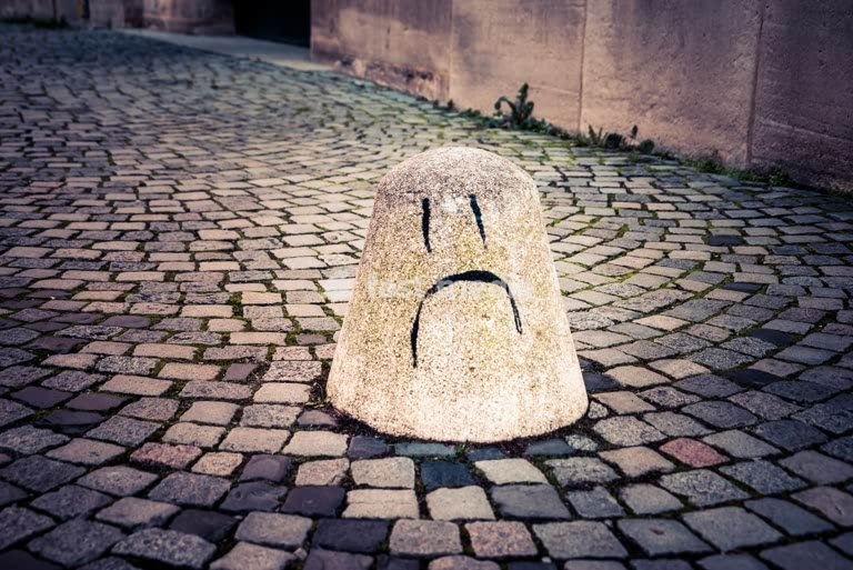 Sad face graffiti