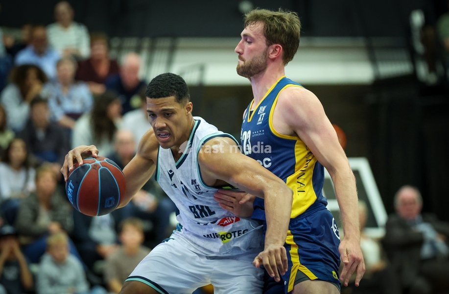 Brussels' Patrick Tape and Oostende's AJ Clayton fight for the ball during a basketball match between Brussels and Oostende, Friday 16 October 2026 in Brussels, on day 3 of the 'BNXT League' Belgian and Dutch first division basket championship