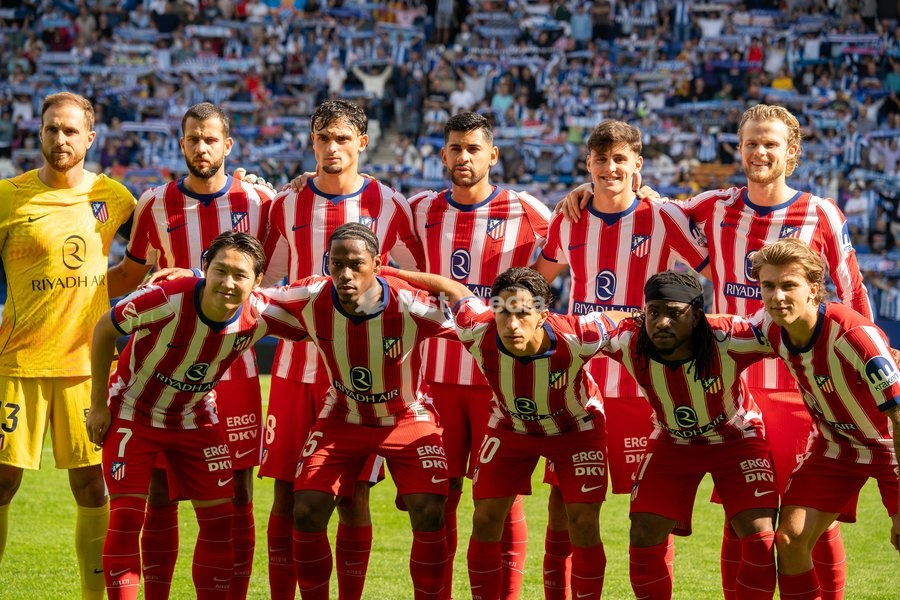 Players of Atletico de Madrid pose for a team
