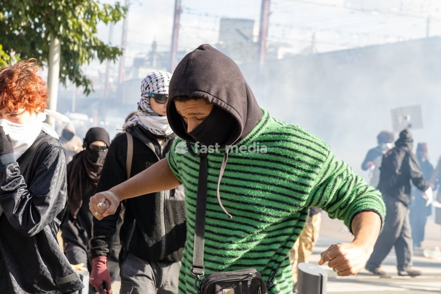 Protesters running away from police tear gas during youths gather for a protest action in Brussels on Saturday 17 October 2026