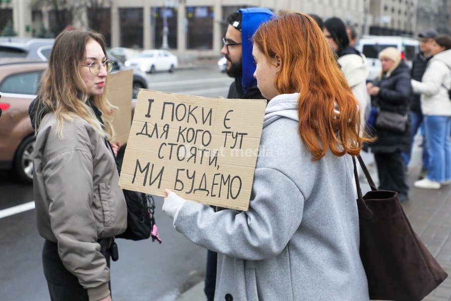 An activist holds a placard reading "And as Long as There Is Someone To Stand Here For, We Will" during the weekly “Don’t Stay Silent! Captivity Kills” rally in support of Ukrainian military personnel held in Russian captivity or listed as missing in action in Maidan Nezalezhnosti (Independence…