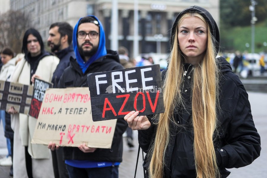 A demonstrator holds a placard reading "Free Azov" in Maidan Nezalezhnosti (Independence Square) during the weekly “Don’t Stay Silent! Captivity Kills” rally in support of Ukrainian military personnel held in Russian captivity or listed as missing in action, Kyiv, Ukraine, October 18, 2026