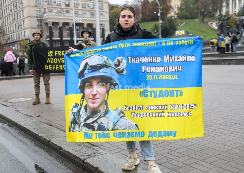 A woman holds a banner featuring a missing Ukrainian soldier during the weekly “Don’t Stay Silent! Captivity Kills” rally in support of Ukrainian military personnel held in Russian captivity or listed as missing in action in Maidan Nezalezhnosti (Independence Square), Kyiv, Ukraine, October 18, 2026