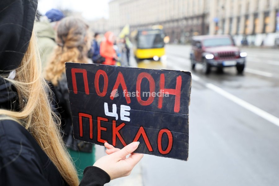 An activist holds a placard reading "Captivity Is Hell" in Maidan Nezalezhnosti (Independence Square) during the weekly “Don’t Stay Silent! Captivity Kills” rally in support of Ukrainian military personnel held in Russian captivity or listed as missing in action, Kyiv, Ukraine, October 18, 2026