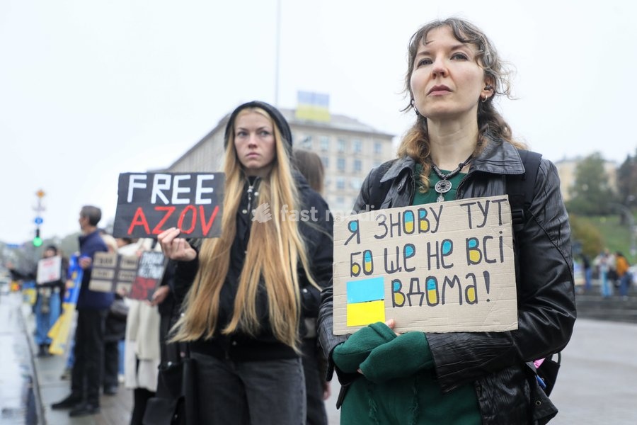 An activist holds a placard reading "Standing Here Once Again, Because Not Everyone Is Home Yet!" during the weekly “Don’t Stay Silent! Captivity Kills” rally in support of Ukrainian military personnel held in Russian captivity or listed as missing in action in Maidan Nezalezhnosti (Independence…