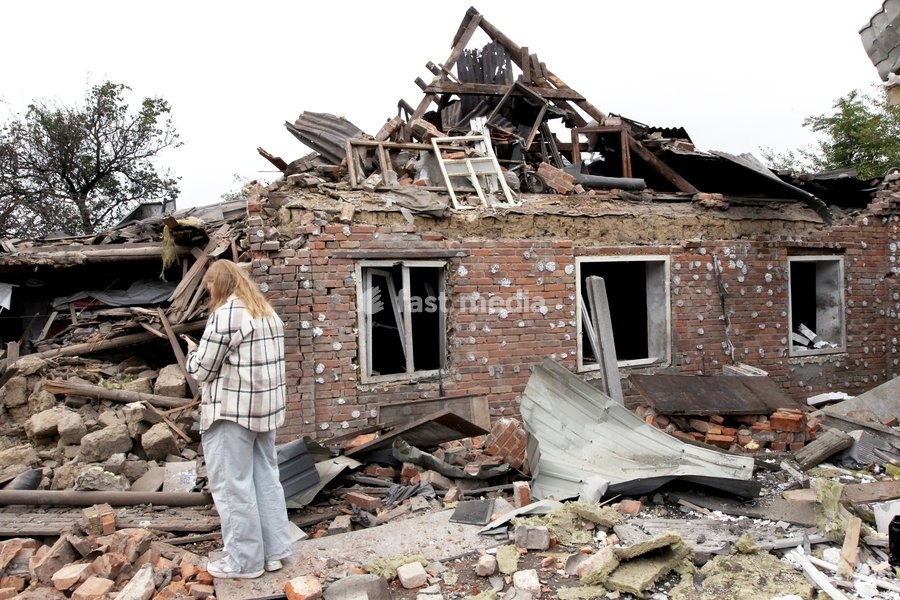 A woman stands among the rubble outside a house damaged by a Russian bombardment in Dnipro, Ukraine, October 19, 2026. On Monday morning, Russian forces launched guided aerial bombs at the eastern city, damaging private homes and infrastructure. An 84-year-old woman was hospitalised in moderate…