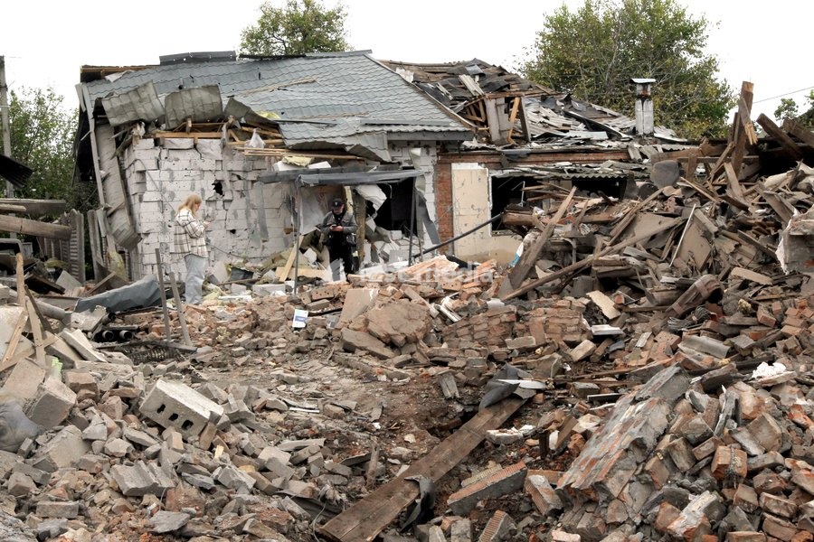 A man and a woman stand among the rubble near a house damaged by a Russian bombardment in Dnipro, Ukraine, October 19, 2026. On Monday morning, Russian forces launched guided aerial bombs at the eastern city, damaging private homes and infrastructure. An 84-year-old woman was hospitalised in…
